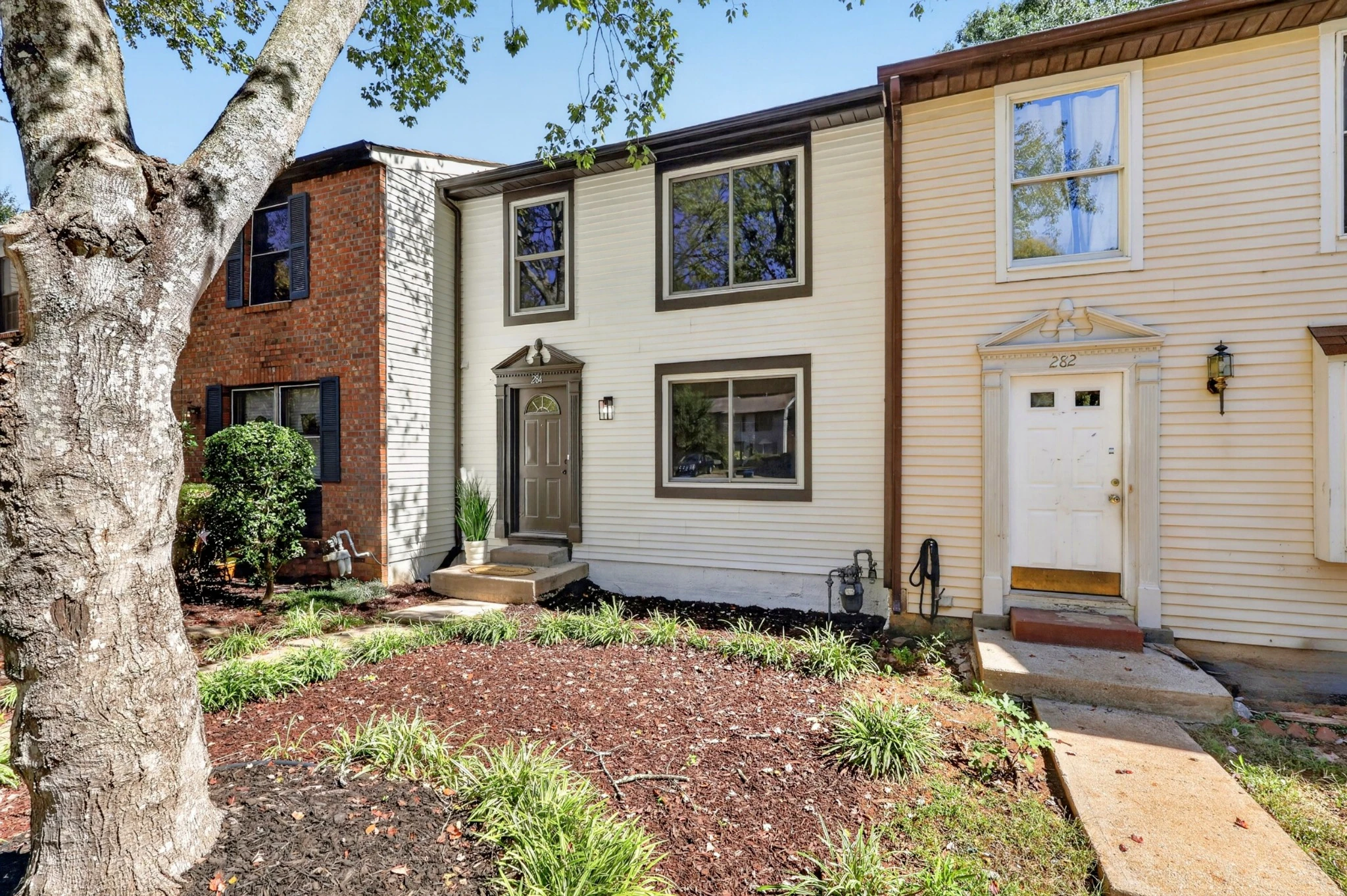 Front elevation and mature tree · 284 Roswell Commons Circle
