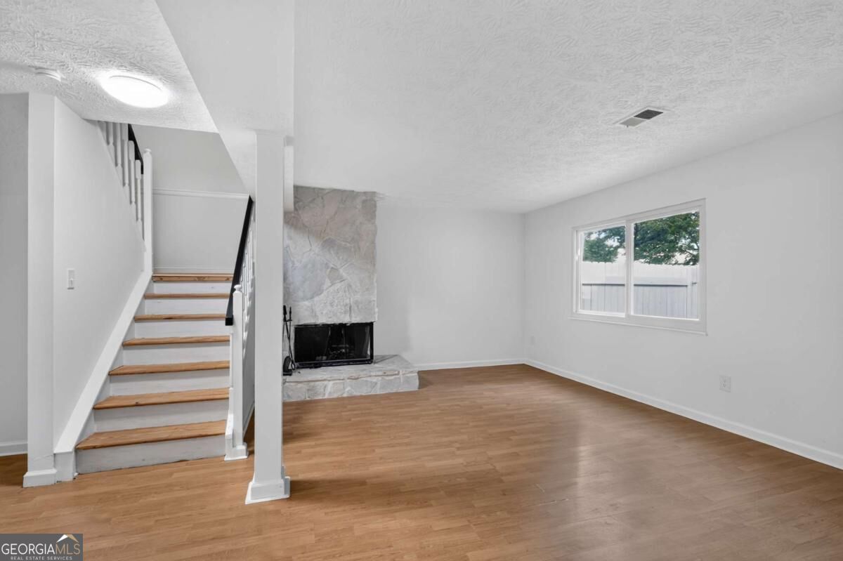 Finished lower level and fireplace · 284 Roswell Commons Circle